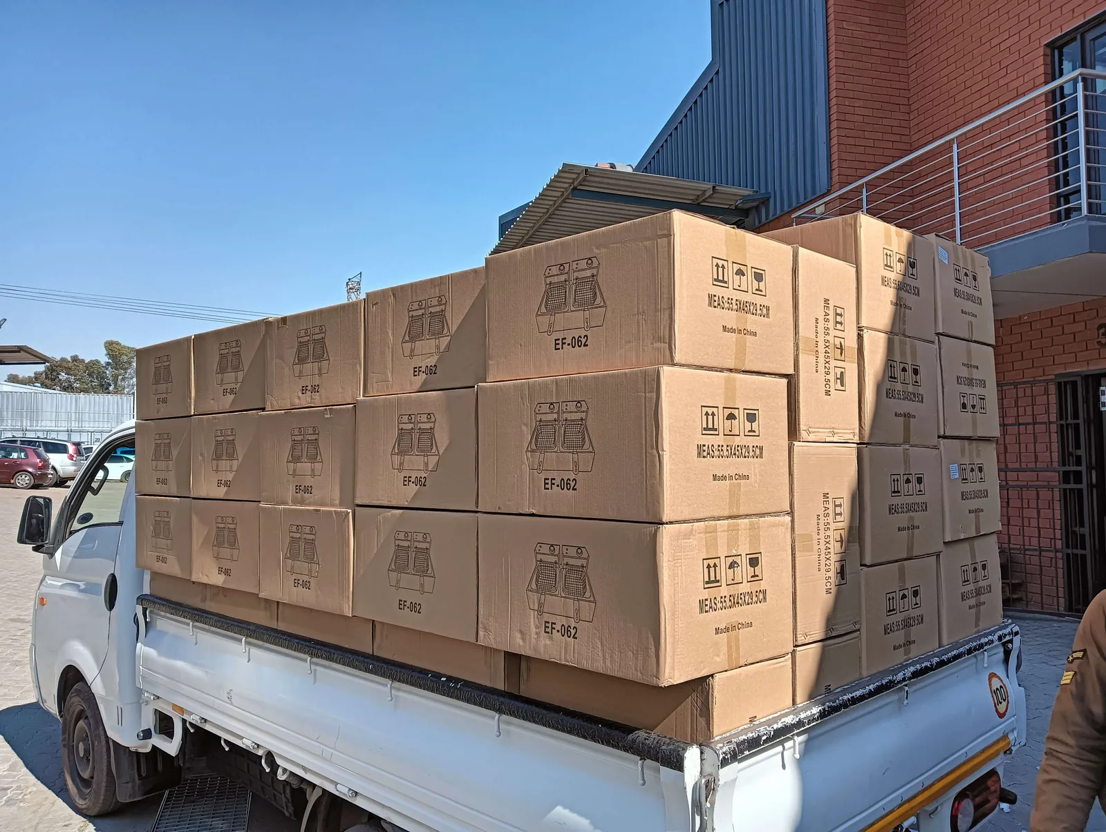 Bakkie loaded with boxed commercial equipment outside a Gauteng warehouse