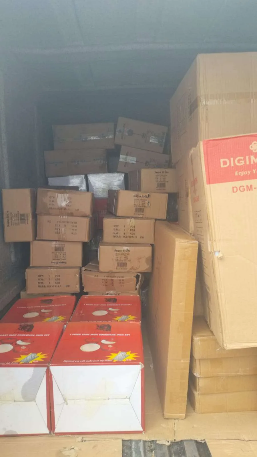 Mixed boxed goods arranged inside a Crown Courier truck