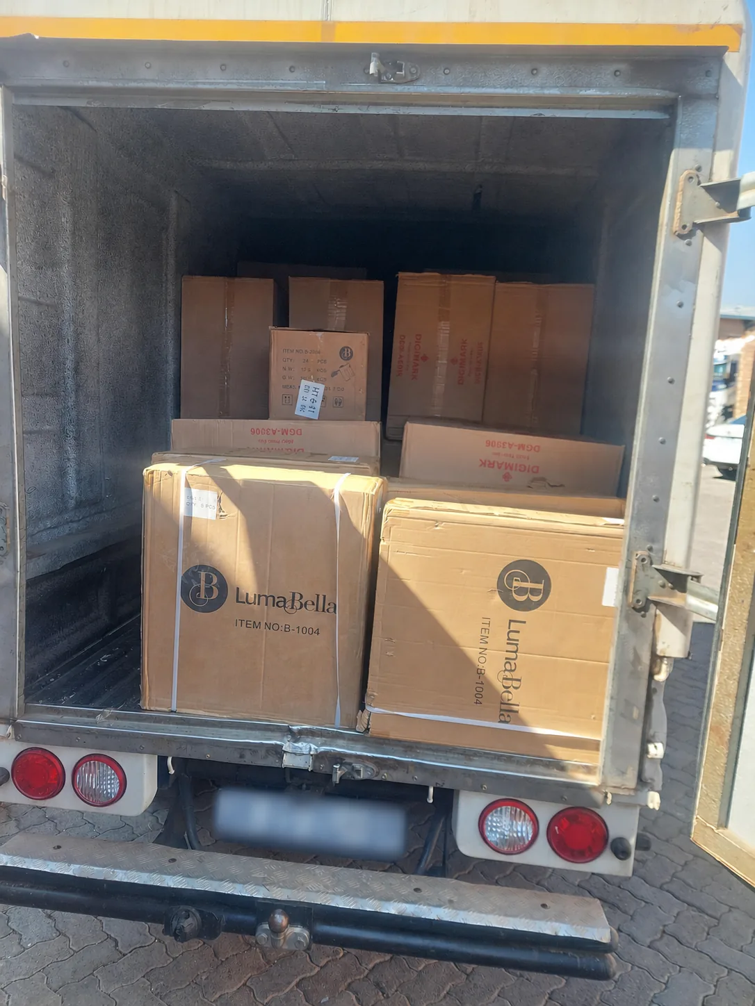Boxed seller stock secured inside a delivery truck